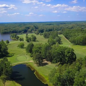 Golf course with ponds and trees