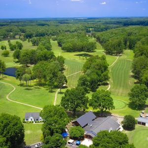 Aerial view of golf course with trees