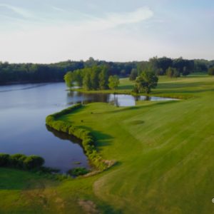 Golf course with trees and water